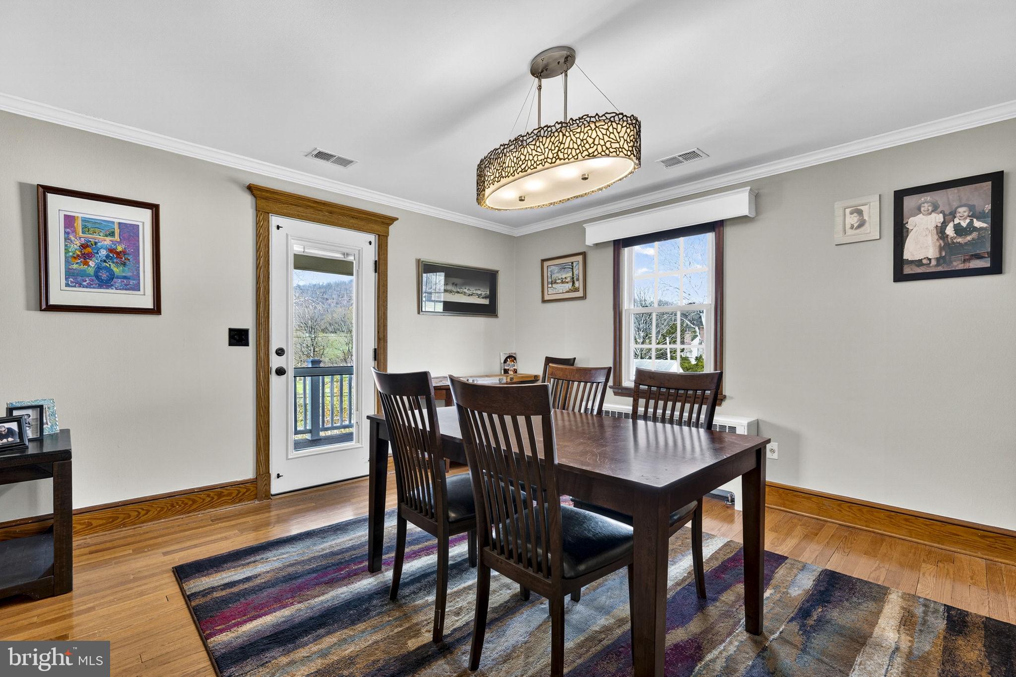 653 Federal Street Paris, VA 20130 - Photo 15 of 64 a view of a dining room with furniture window and wooden floor