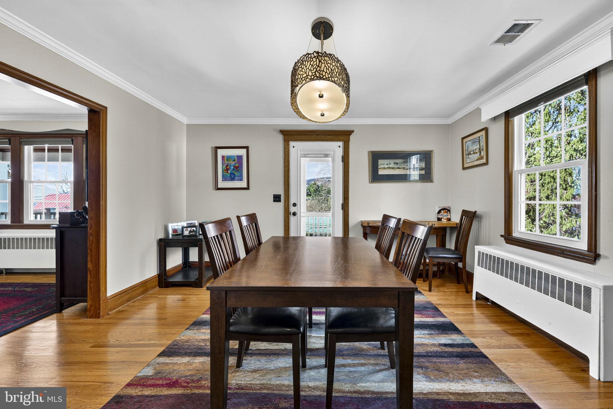 653 Federal Street Paris, VA 20130 - Photo 16 of 64 a view of a dining room with furniture window and wooden floor