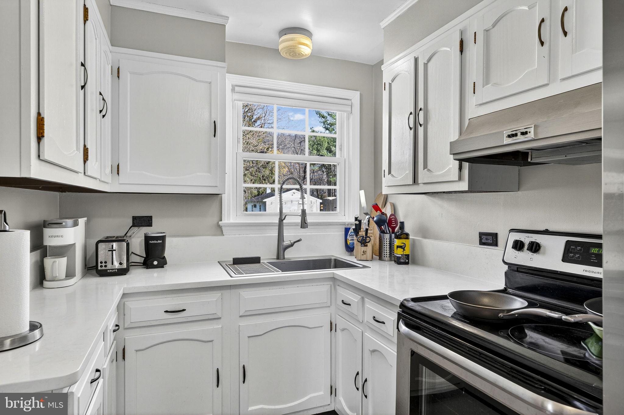 653 Federal Street Paris, VA 20130 - Photo 17 of 64 a kitchen with stainless steel appliances granite countertop a sink stove and cabinets