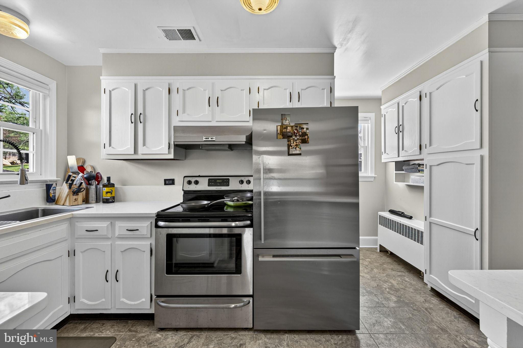 653 Federal Street Paris, VA 20130 - Photo 18 of 64 a kitchen with cabinets stainless steel appliances and a window