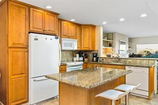 101 Shell Road, Unit 280 Watsonville, CA 95076 - Photo 4 of 10 a kitchen with stainless steel appliances granite countertop a refrigerator and a stove top oven