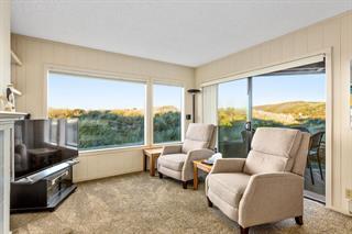 101 Shell Road, Unit 280 Watsonville, CA 95076 - Photo 7 of 10 a living room with furniture and a floor to ceiling window