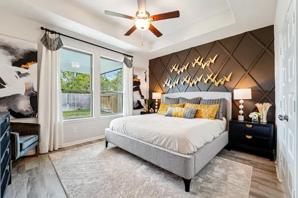 a bedroom with a large bed and a window