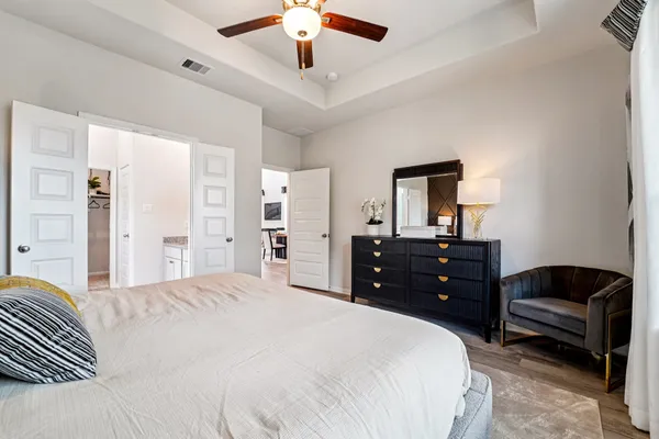 a bedroom with a bed and a dresser