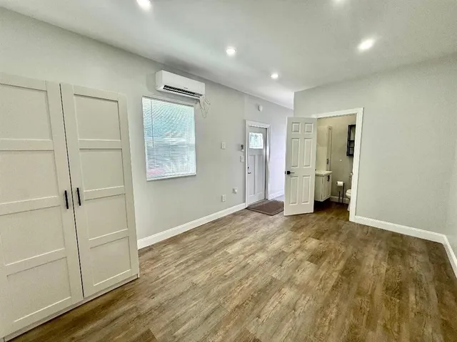 a view of an empty room and closet area