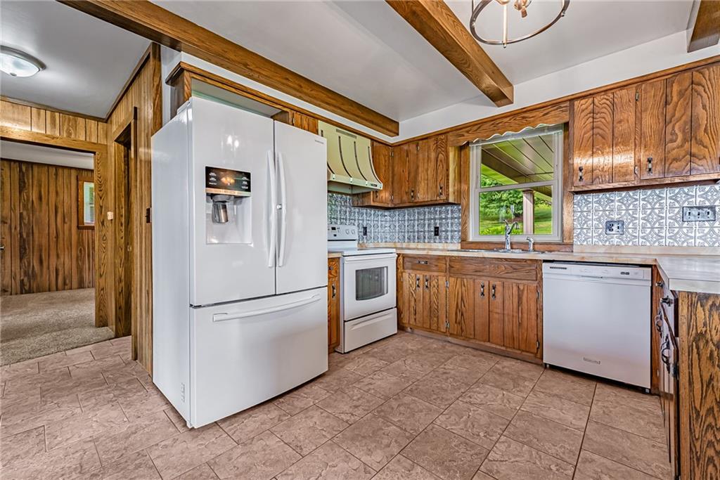 207 Pineslope Road Acme, PA 15610 - Photo 8 of 25 a kitchen with a refrigerator sink and stove