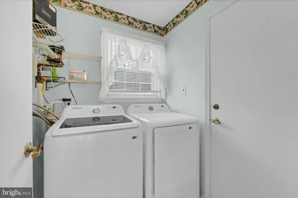 a utility room with dryer and washer
