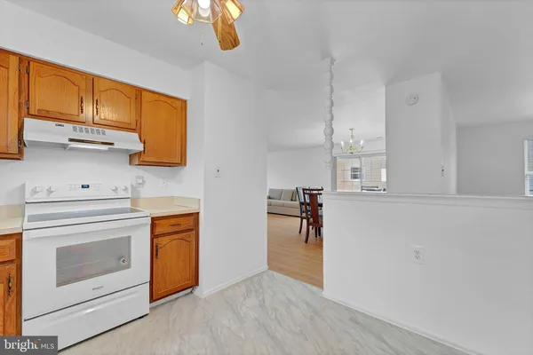 a view of a kitchen with electric appliances
