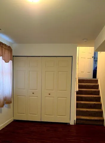 a view of a livingroom with wooden floor