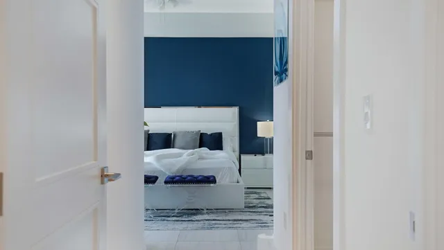 a bathroom with a double vanity sink toilet and a mirror