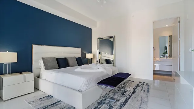 a bathroom with a granite countertop sink a toilet and shower