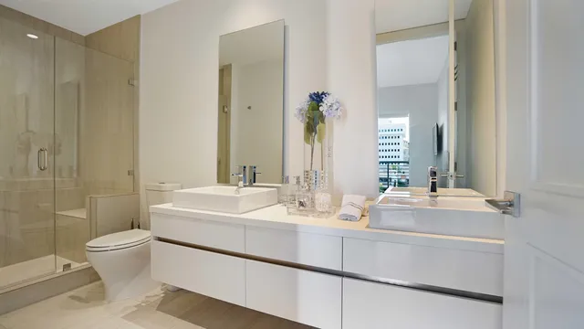 a en suite bathroom with a sink and a mirror
