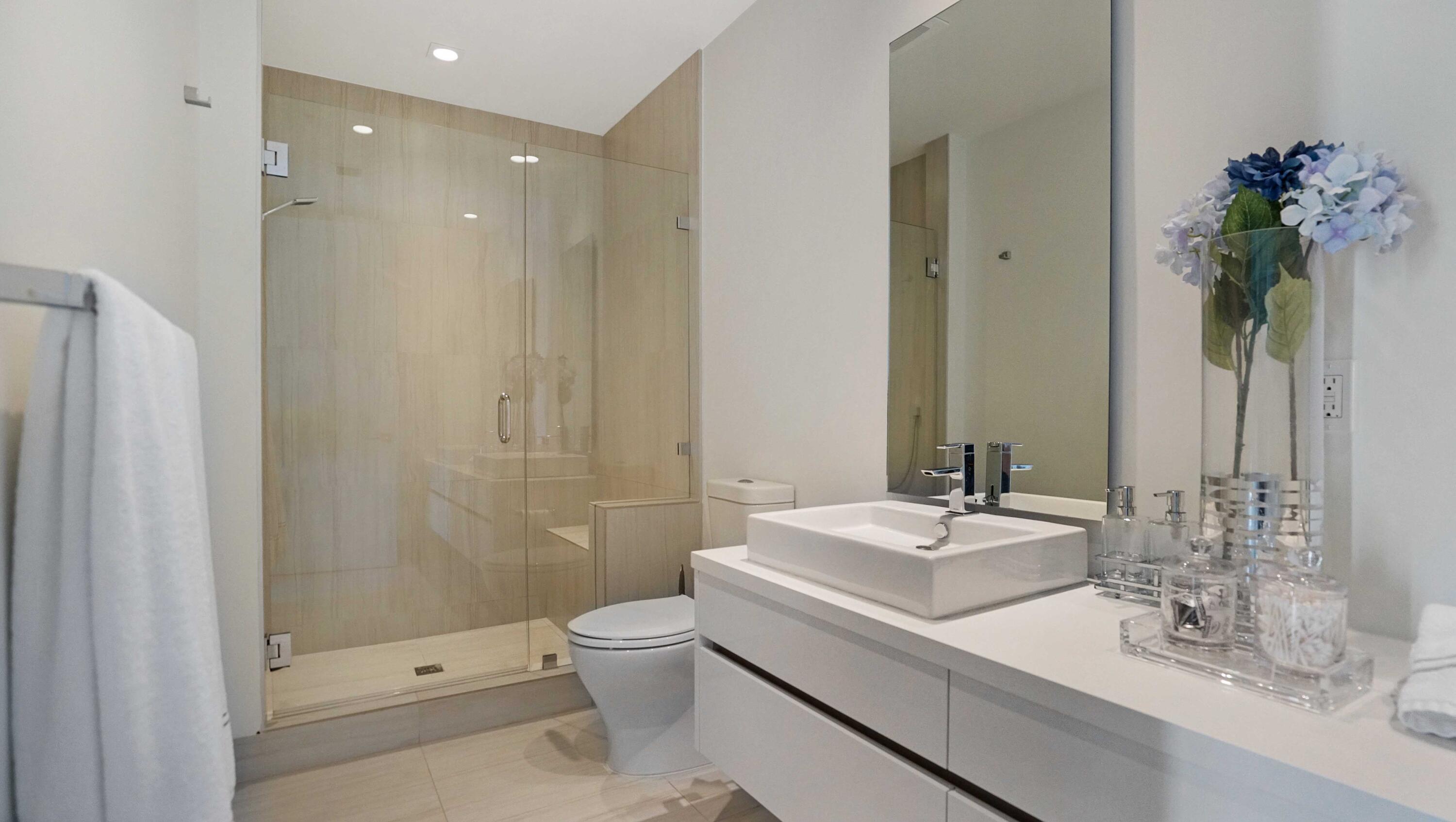 155 East Boca Raton Road, Unit 501 Boca Raton, FL 33432 - Photo 19 of 83 a bathroom with a granite countertop sink a toilet and shower