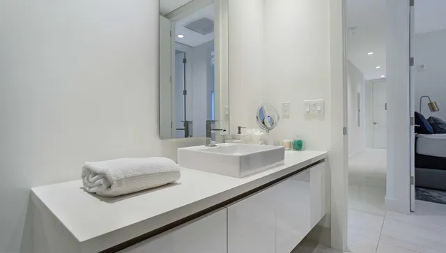 a bathroom with a mirror and a shower