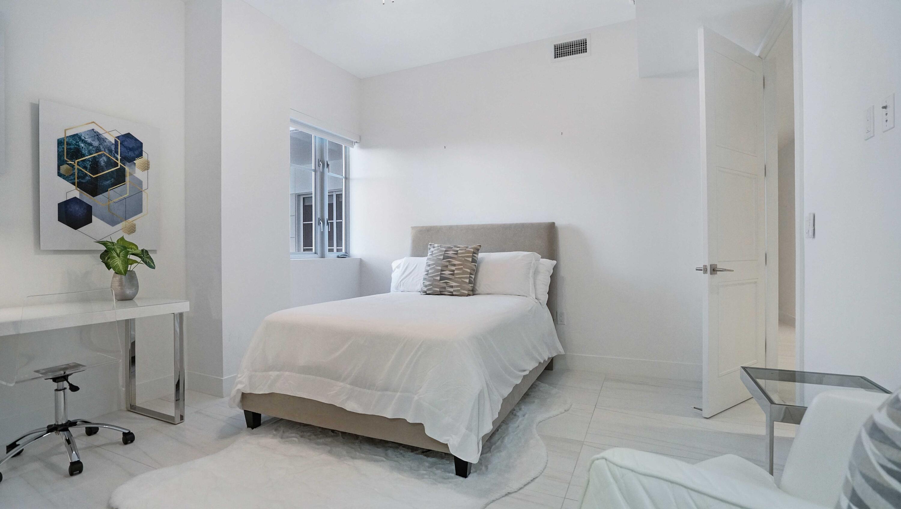 155 East Boca Raton Road, Unit 501 Boca Raton, FL 33432 - Photo 28 of 83 a bedroom with a bed and a window