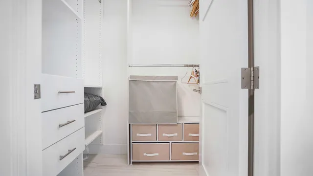 a living room with furniture a flat screen tv and a large window