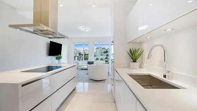 a living room with furniture large window and flat screen tv