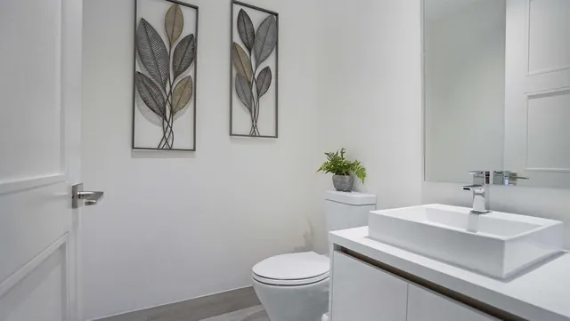a living room with furniture and a lamp