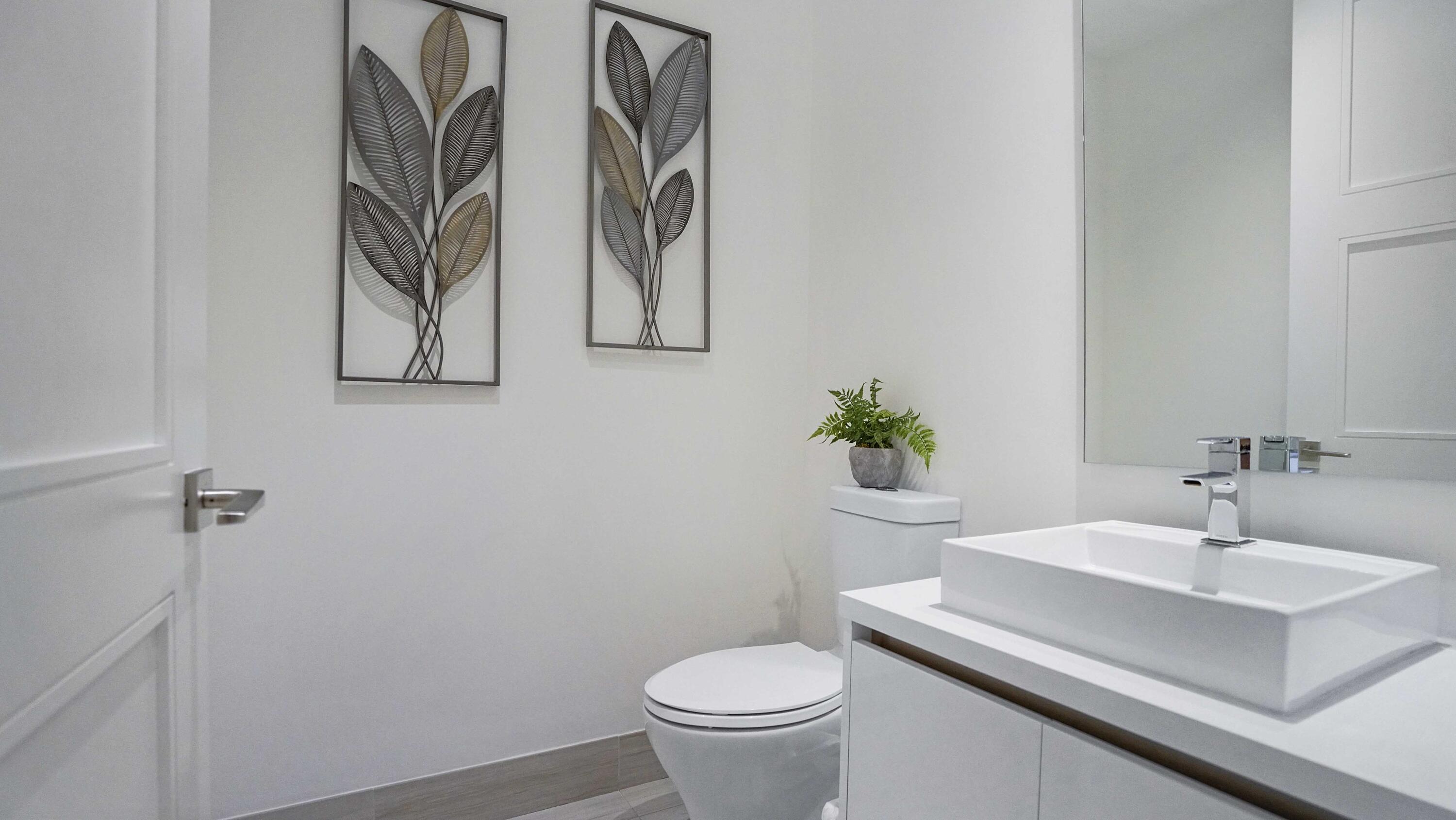 155 East Boca Raton Road, Unit 501 Boca Raton, FL 33432 - Photo 36 of 83 a bathroom with a sink a toilet and a mirror