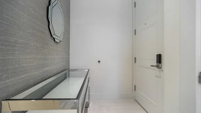 a view of a patio with couches under an umbrella