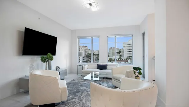 a view of backyard with table and chairs under an umbrella