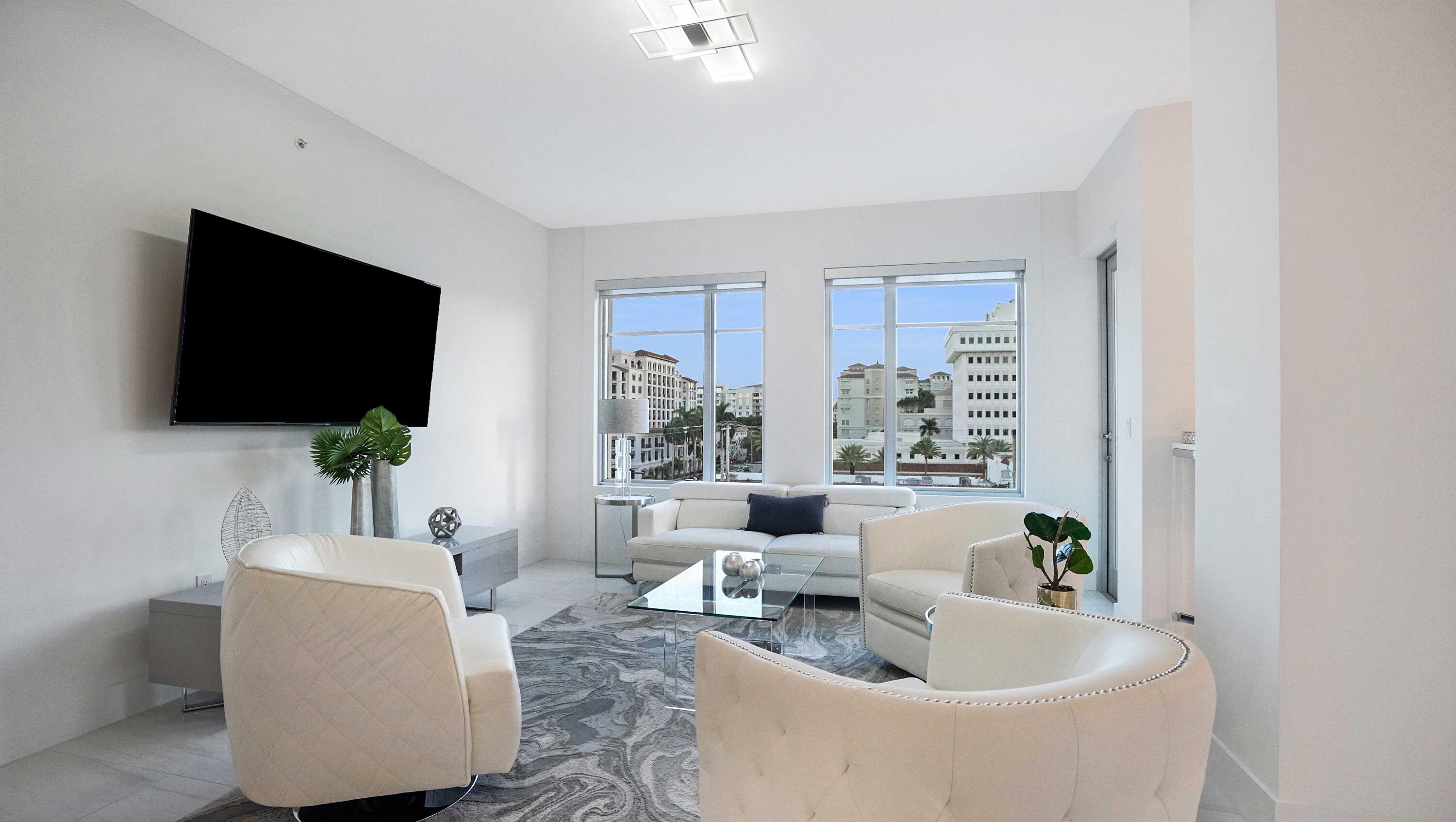 155 East Boca Raton Road, Unit 501 Boca Raton, FL 33432 - Photo 41 of 83 a living room with furniture and a flat screen tv