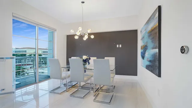 a front view of a house with plants