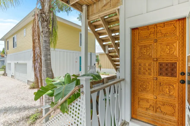 a kitchen with a sink a stove top oven and washer dryer