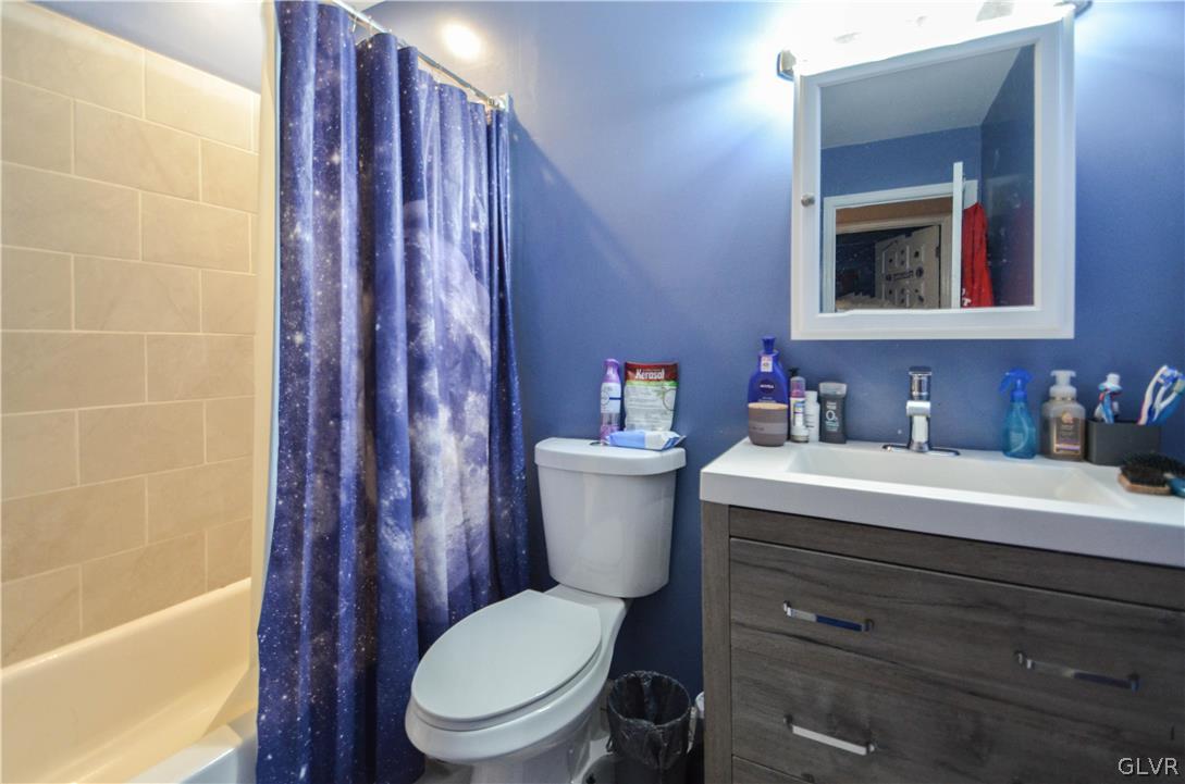 101 Coolbaugh Road East Stroudsburg, PA 18302 - Photo 16 of 24 a bathroom with a granite countertop toilet sink and mirror