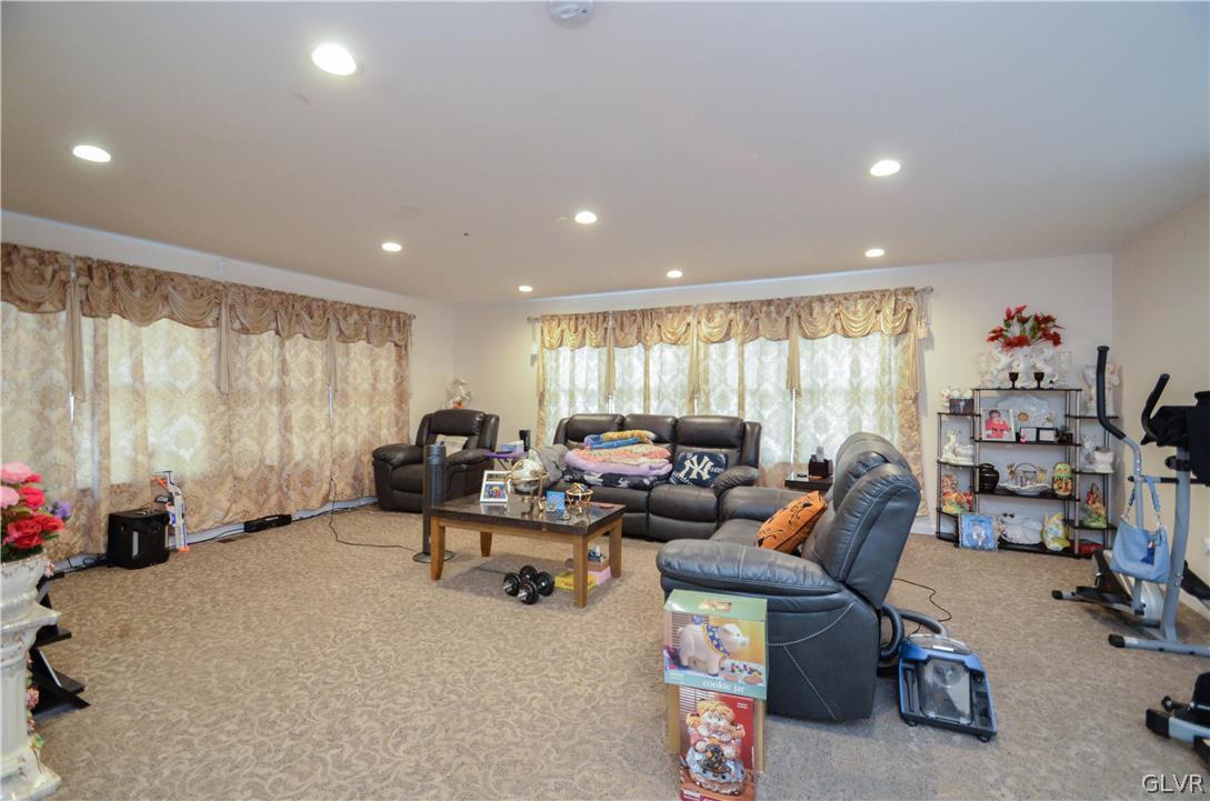 101 Coolbaugh Road East Stroudsburg, PA 18302 - Photo 2 of 24 a living room with furniture a window and a flat screen tv