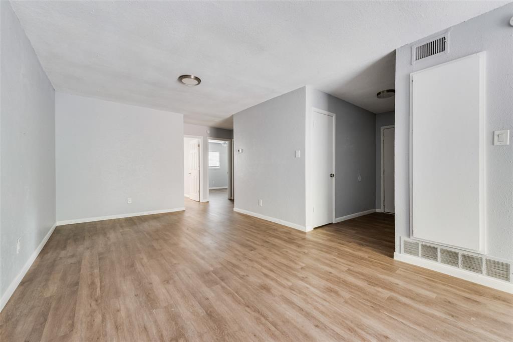415 Pierce Street Denton, TX 76201 - Photo 3 of 14 a view of an empty room with wooden floor