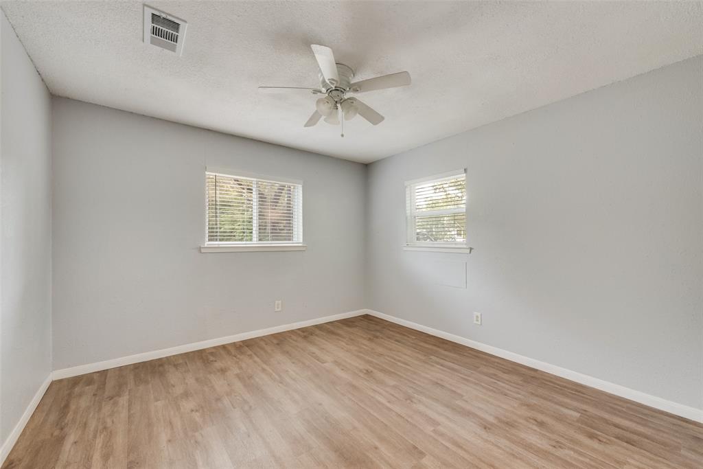 415 Pierce Street Denton, TX 76201 - Photo 8 of 14 wooden floor in an empty room with a window