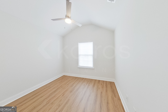 231 Western Red Cedar Drive Springfield, GA 31329 - Photo 16 of 26 a view of a room with wooden floor and window