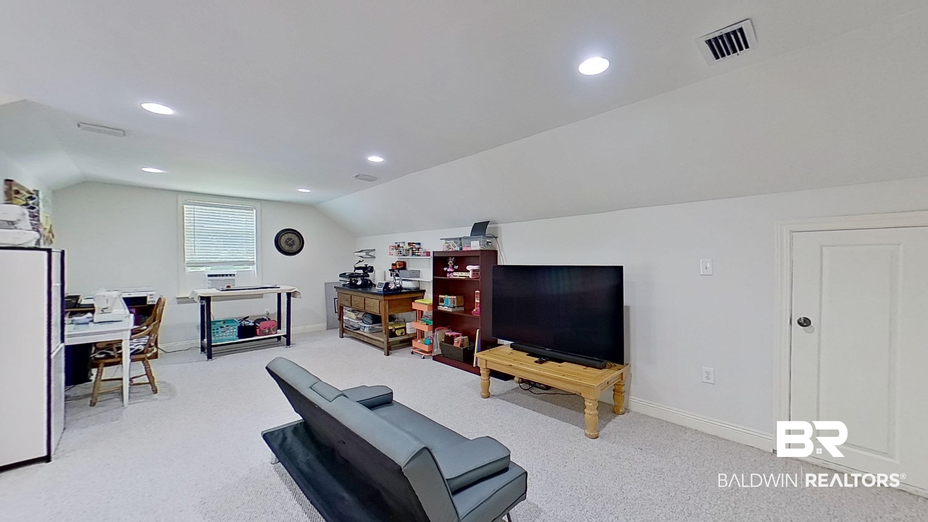 4340 Hamilton Oaks Lane Mobile, AL 36695 - Photo 31 of 51 Carpeted living room featuring vaulted ceiling