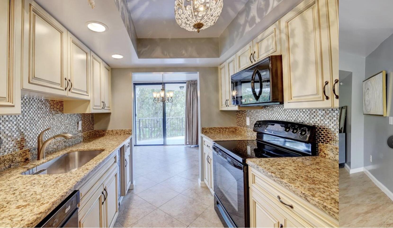 859 Jeffery Street, Unit 3030 Boca Raton, FL 33487 - Photo 4 of 24 a kitchen with stainless steel appliances granite countertop a stove a sink and a microwave