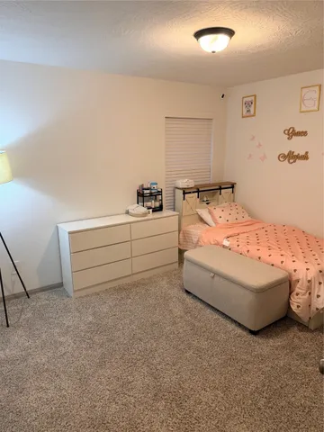 a bed room with a bed and a couch