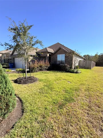a swimming pool with outdoor seating and yard