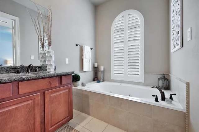 a bathroom with a bathtub and a sink