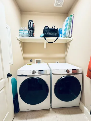 a utility room with dryer and washer