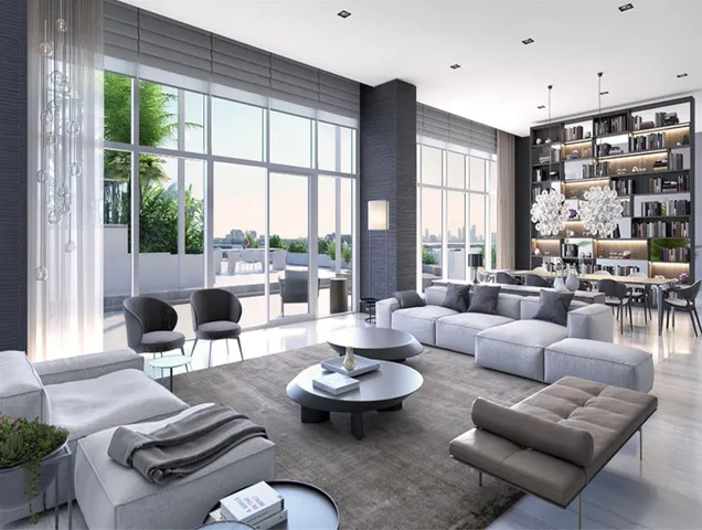 a living room with furniture and a large window