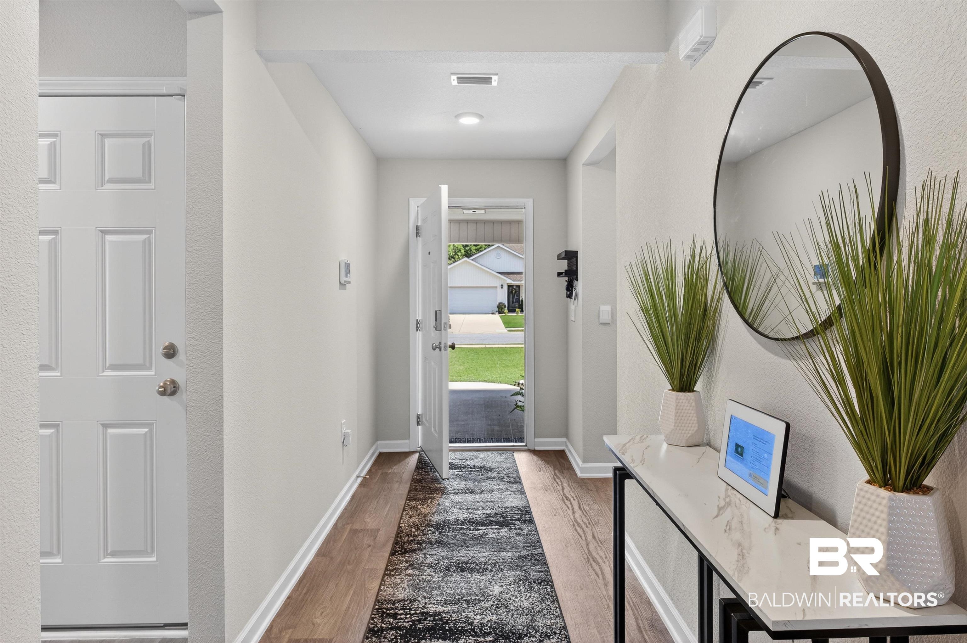 3213 Camino Real Loop Lillian, AL 36549 - Photo 19 of 61 Inviting entryway featuring wood-finish flooring, light gray wall paint, and recessed ceiling lighting