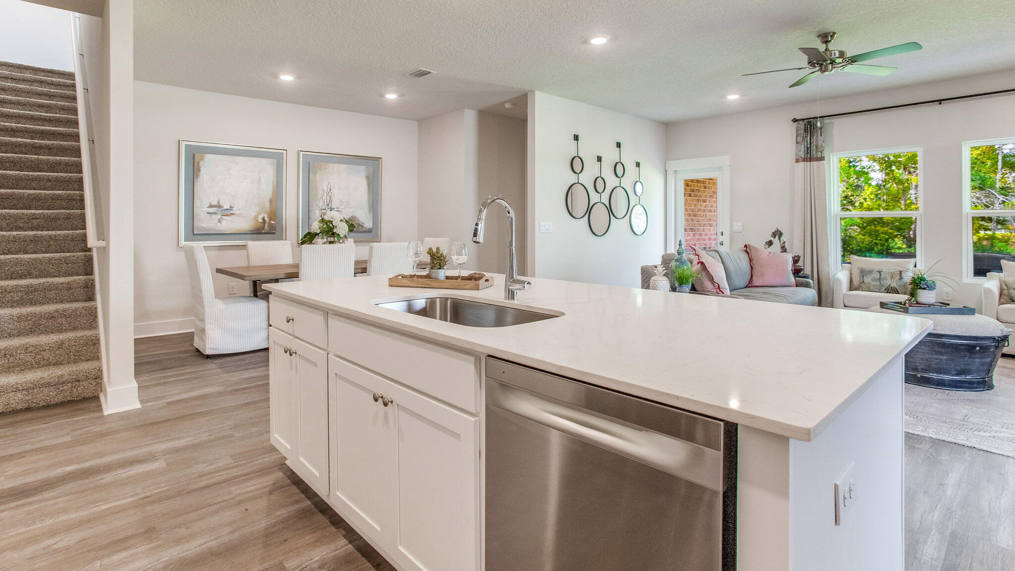 34 Foxtrail Run Freeport, FL 32439 - Photo 10 of 31 a kitchen with kitchen island granite countertop a sink and white cabinets with wooden floor