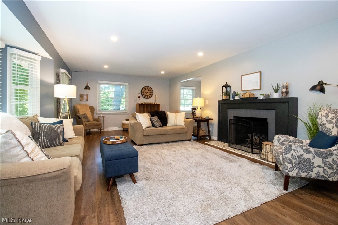 427 Oakley Road Wooster, OH 44691 - Photo 14 of 38 Living room with a brick fireplace and hardwood / wood-style floors