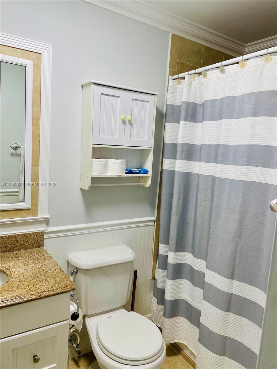 11527 Southwest 90th Terrace Miami, FL 33176 - Photo 12 of 20 a bathroom with a granite countertop sink mirror vanity and toilet