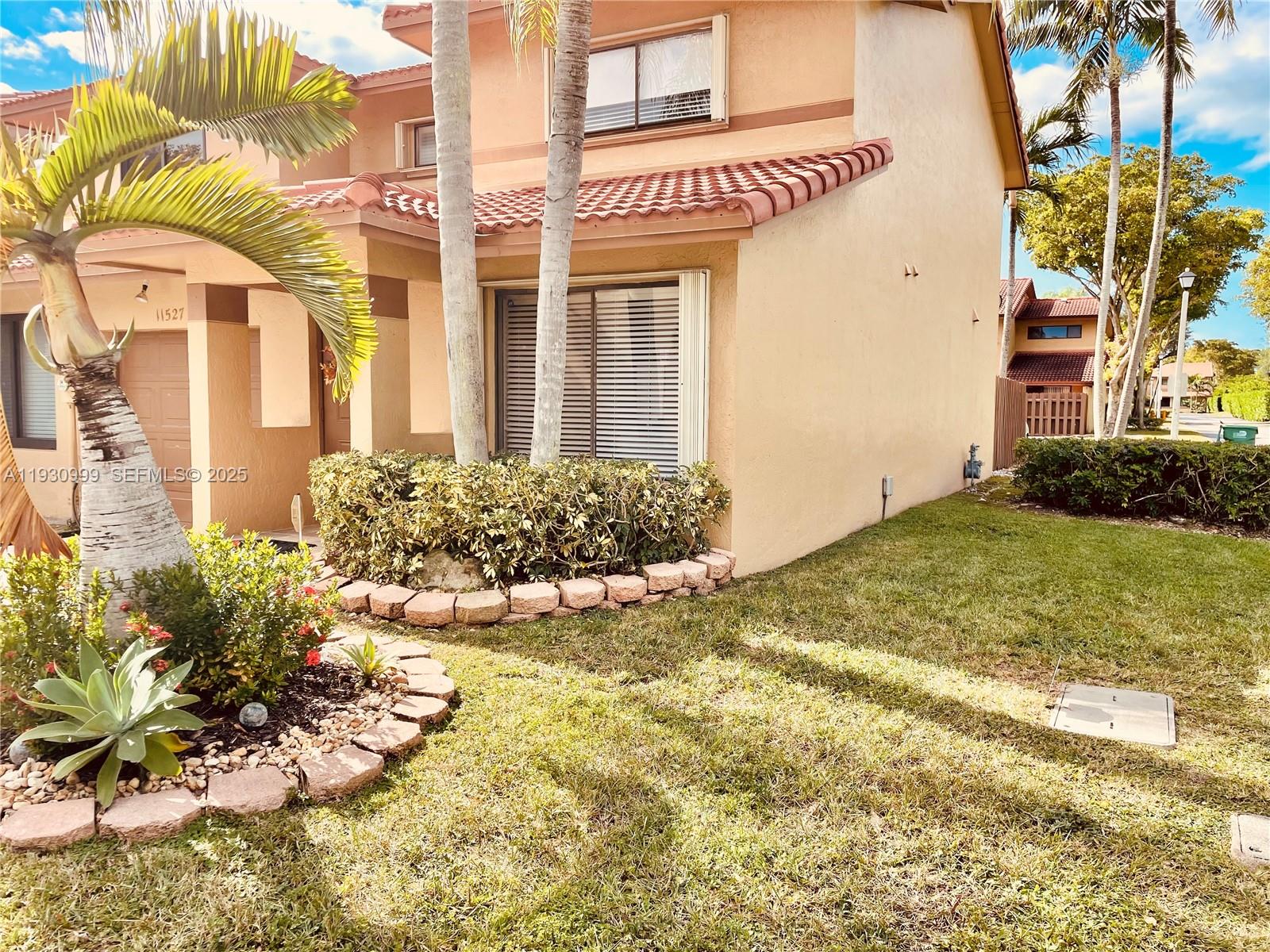 11527 Southwest 90th Terrace Miami, FL 33176 - Photo 20 of 20 a view of a house with a yard and plants