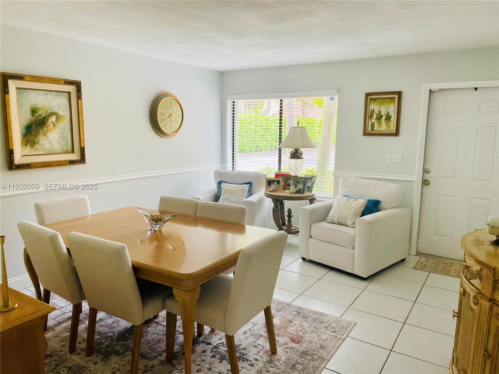 11527 Southwest 90th Terrace Miami, FL 33176 - Photo 2 of 20 a living room with furniture and a large window