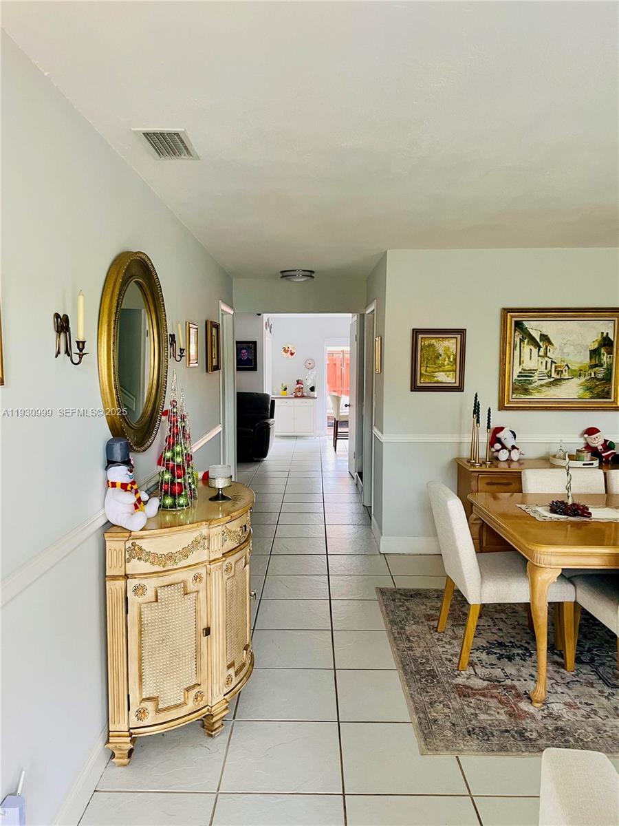 11527 Southwest 90th Terrace Miami, FL 33176 - Photo 3 of 20 a living room with fireplace furniture and a rug