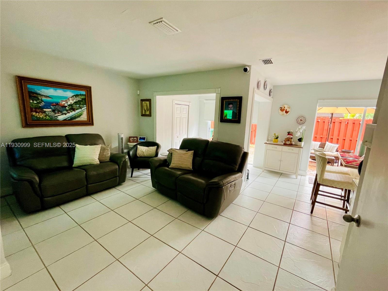 11527 Southwest 90th Terrace Miami, FL 33176 - Photo 5 of 20 a living room with furniture and a couch