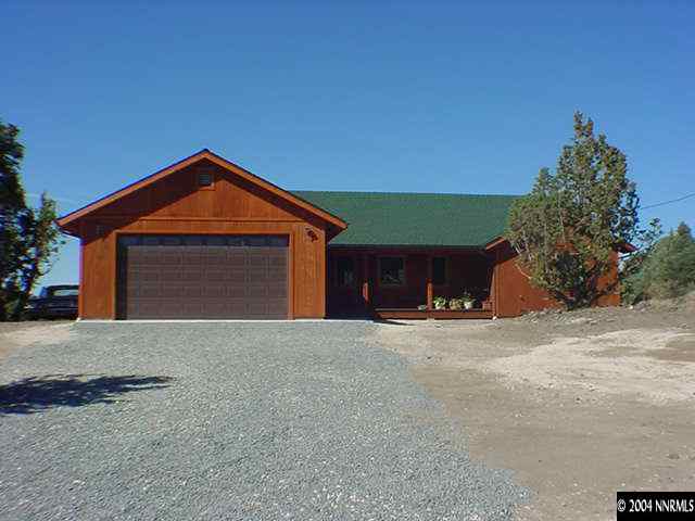 2350 Cartwright Road Reno, NV 89521 - Photo 1 of 1 a front view of a house with a yard and garage