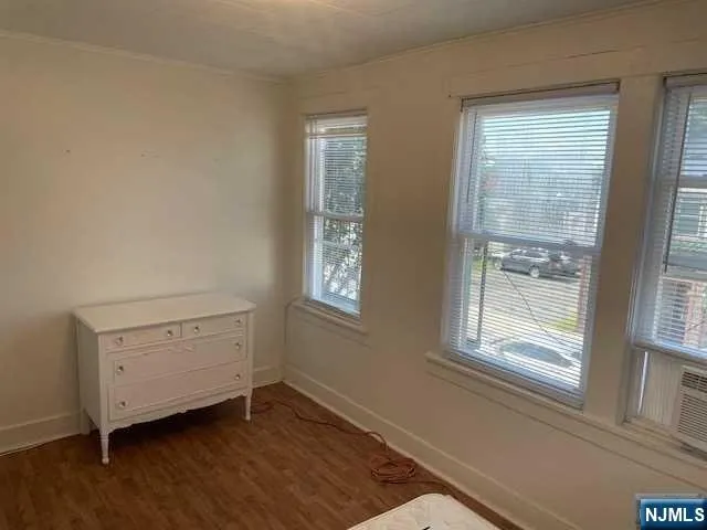 a room with window and cabinet